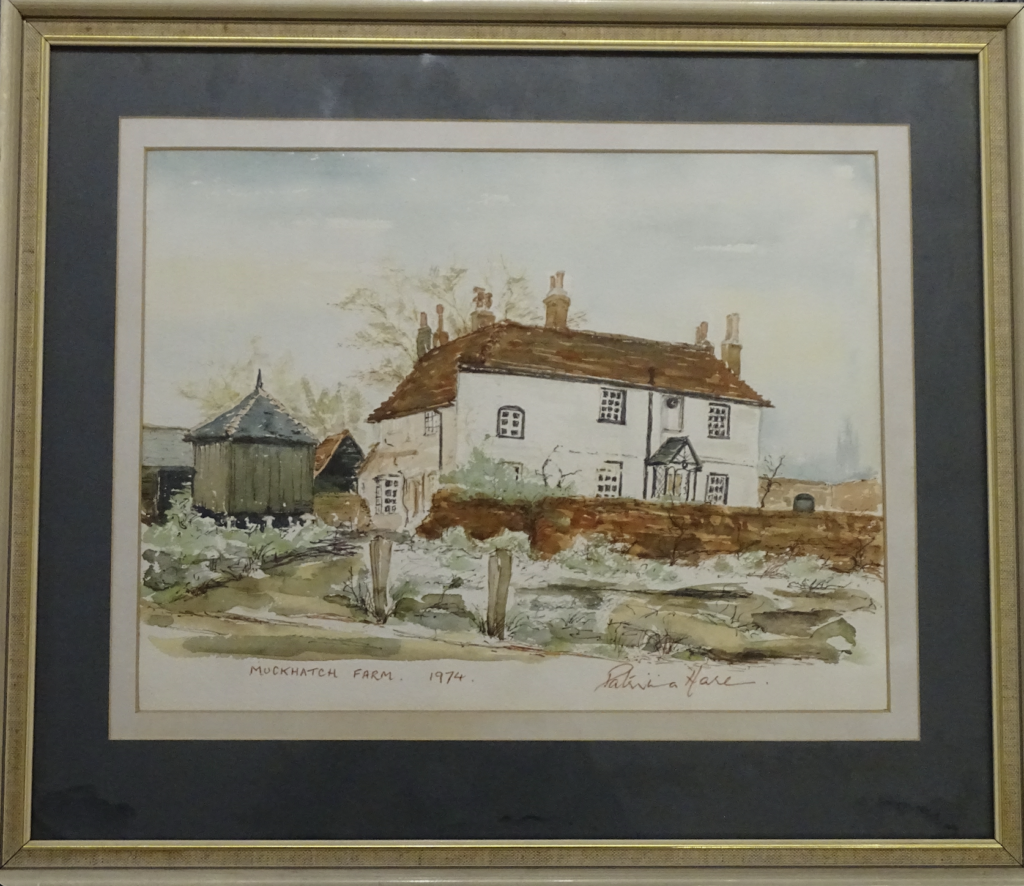 Watercolour painting showing front view of white rectangular building at Muckhatch Farm, with a smaller, brown building to left. Froreground shows green and brown, muddy lawn. Painting signed and dated in red: Patricia Hare reads at the bottom right, and Muckhatch Farm 1974 at the bottom left